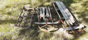 lot 14 image: (3) Vintage Sleds With Metal Frames...