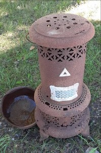 lot 15 image: Antique Stove Burner One Leg is Ru...