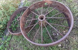 lot 36 image: (2) Vintage Steel Wheels 35.5 See...