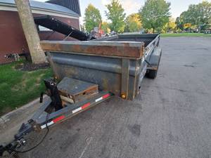 lot 1 image: 2014 Dump Trailer - Steel Ramps stored under the deck
