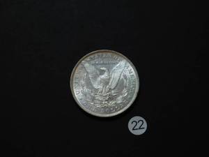 lot 22 image: 1884 BU Morgan Silver Dollar