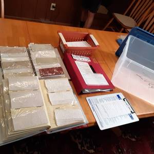lot 29 image: Nice collection of  3-ring binders. in those Binders are an array of cut fabrics and everything you need to start your own custom bookmark business.