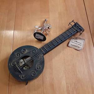 lot 105 image: Vintage Musical box Shaped as a fid...
