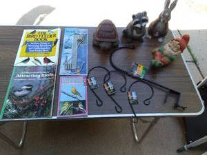 lot 410 image: Books About Birds, Hook It All Deck Hooks, Extension Hooks, Plastic Garden Figurines, and Ceramic Gnome