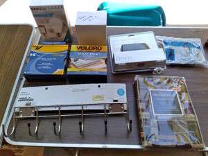 lot 417 image: USB Electric Stapler, (2) 15 Sticky Tape Velcro Pieces, Door Chime Kit, Ladies Non-Slip Snow Grabbers, Valance, Coat Rack, and Vivitar Smart Security LED Bulbs