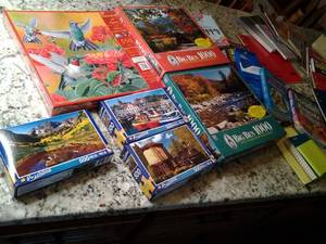 lot 145 image: Puzzles both sealed and some open w...