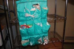 lot 648 image: Hanging Door Storage Bin Full of Cr...