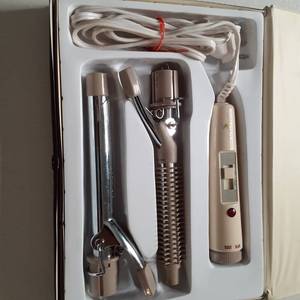 lot 779 image: Vintage Polo by Hatman Electric Curling Iron with 2 interchangeable heads so you can switch between the brush style iron and the standard barrel iron in a snap to close storage case