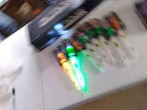 lot 764 image: Pictionary, puzzles, Yu-Gi-Oh storage tin and a handful of Lifegear flashlightglow stick combos