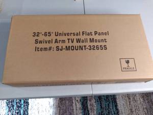 lot 0500 image: New in box Universal Flat Panel swivel TV arm mount for 32 to 65 inch TVs