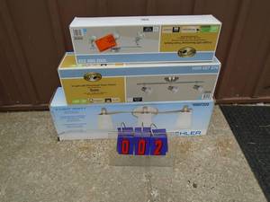 lot 2 image: Store return lighting fixtures. Some boxes have been opened. As shown.
