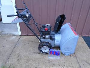 lot 27 image: MTD snow blower. Used condition. Tested & works. As shown.