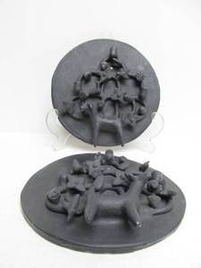 lot 36 image: Matching Pair of Vintage Black Clay Folk Art Wall Plaques 