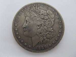 lot 233 image: 1889 CC Morgan Silver Dollar