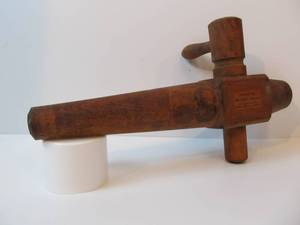 lot 22 image: Larger Antique Wooden Barrel Spigot - Redlichs Warranted Faucets