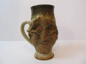 lot 15 image: Pair of Signed Whimsical Stoneware Face Mugs