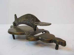 lot 16 image: Antique Solid Brass Coconut Cutter