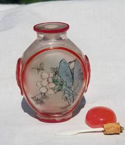 lot 27 image: Carved Cameo Glass Reverse Painted Snuff Bottle