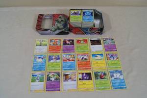 lot 82 image: Metal Box of Pokemon Cards - Most Common or Uncommon