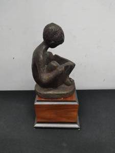 lot 134 image: Austin Prod Sculpture of Boy Reading Book