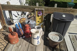 lot 87 image: Garden Decor and Trash Can Pitcher, Lantern, Sun, Metal Flower, Metal Bunny, and More