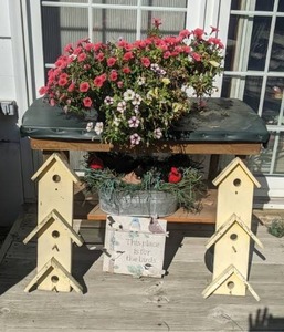 lot 83 image: For the Birds Lot Bird Houses, Decor, Cart, and Flowers