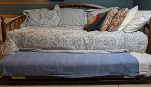 lot 110 image: Beautiful Wooden Trundle Bed w Bedding & More