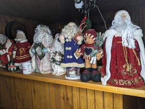 lot 280 image: All the Christmas... Santa Figurines, Christmas Lightpost, Christmas Glasses and Decor