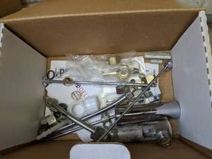 lot 246 image: Odd Grouping of Items Vidal Sassoon Blow Dryer, Moen Faucet, Garden Hose & Brackets