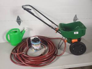 lot 12 image: Lawn Spreader, 2 Garden Hoses, Watering Can