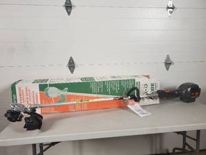 lot 15 image: New Core Power-Lok Lithium Ion String Trimmer - No Charger