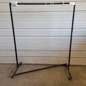 lot 313 image: Black 52.5 x 63.5 Industrial Steel Commercial Grade Garment Rack (Left)