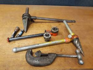 lot 748 image: TOLEDO 00 Pipe Threader w 12 and 34 Dies, RIDGID 2-S Spiral Reamer, Unknown Reamer and Saunders #12 Pipe Cutter (18 to 2 Pipe)