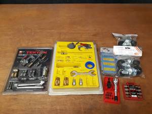 lot 769 image: Kits Air Tool Parts, Nut Driver Bits and (2) 4-Packs of 2 Caster Wheels