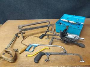 lot 875 image: 12V Chainsaw Sharpener, Saws, Brick Carrier and More