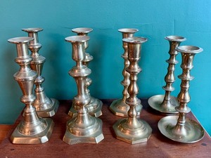 Four Sets of Brass Candle Holders