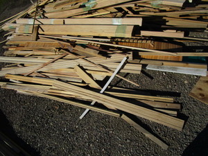 lot 105-B image: Pile of Trim Pcs, Hardwood Floor Pcs & Misc. Wood Pcs