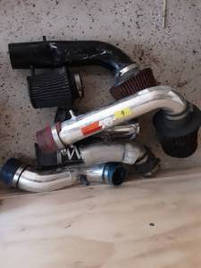 lot 6 image: Pile Of After Market Cold Air Intakes