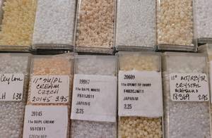14 Vials of WhiteIvoryCream Micro Beads in a Variety of Sizes
