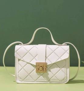 lot 24 image: Twist Lock Quilted Flap Square Bag
