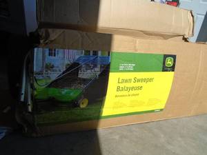 lot 2 image: John Deere 44 lawn sweeper. New in box. Looks complete but may be missing some hardware. Needs to be assembled. As shown.