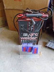 lot 8 image: Lincoln 220 volt Arc Welder. 200 amp with cables. Tested & works. As shown.
