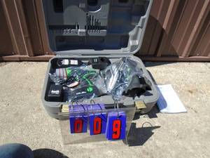 lot 9 image: New Kawasaki 19.2 volt drill & saw kit. Includes 2 batteries & charger along with flashlight. Trade show sample. As shown.