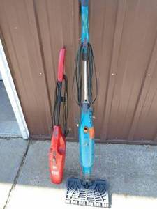 lot 13 image: Shark steam mop & Dirt Devil simple stik. Looks lightly used. Store models. Tested & works. As shown.
