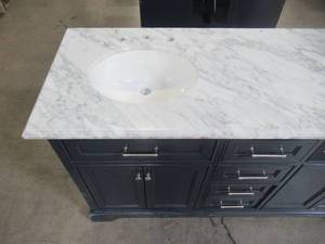 lot 325 image: Home Decorators Collection Windlowe 61 in. W x 22 in. D x 35 in. H Bath Vanity in Navy Blue with Carrara Marble Vanity Top in White with White Sink 15101-VS61C-NB