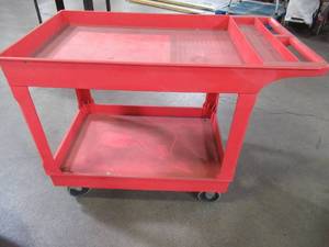 lot 54 image: Double Shelf Push Utility Cart In Red 45 x 25 12 x 33 Tall.