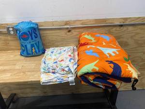 lot 76 image: Kids Dinosaur Bedding and Toy Story Slumber Sack