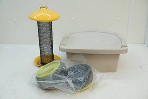 lot 36 image: Hose hanger, birdhouse and tires