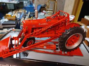 lot 11 image: Precision Series Farmall MD with McCormick Loader 116th Scale