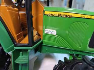 lot 31 image: Ertl John Deere Plastic Tractor 116th Scale - No Box, 6420 written in pen on the side